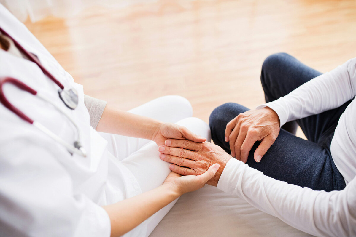 A physician visiting a patient at home.